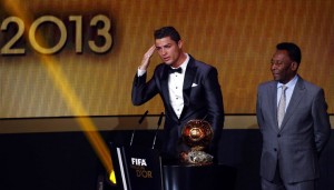 Portugal's Cristiano Ronaldo gestures beside Pele after being awarded the FIFA Ballon d'Or 2013 in Zurich