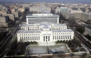 The US Federal Reserve Building is seen from the air over Washington, DC, 18 January 2008. President George W. Bush called Friday for Congress to act quickly on a stimulus plan worth around 140 billion USD to revive a US economy that some fear is on the brink of recession. Bush said that he has consulted with lawmakers and added: "I believe there is enough broad consensus that we can come up with a package that can be approved with bipartisan support." The news came amid the latest round of weak economic news and a downward spiral on Wall Street that prompted Federal Reserve chairman Ben Bernanke and others to talk up the need for swift action. AFP PHOTO/SAUL LOEB (Photo credit should read SAUL LOEB/AFP/Getty Images)